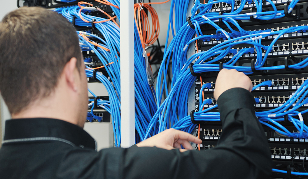Image of Technician Patching in Cables