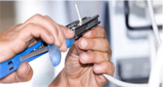 Image of Technician Terminating Cable Image of Technician Terminating Cable