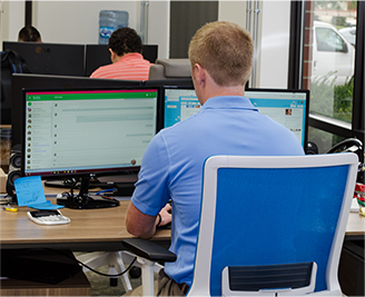 Image of IT Professional Working at His Desk