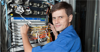 Image of Network Engineer Working on Fiber Patch Panel Image of Network Engineer Working on Fiber Patch Panel