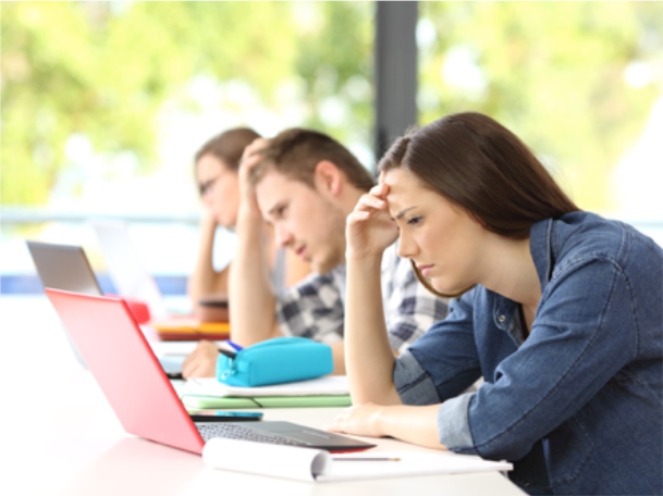 Image of Frustrated Students Working on Laptops Image of Frustrated Students Working on Laptops