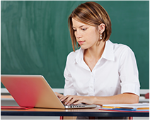 Image of Teacher Working on Laptop