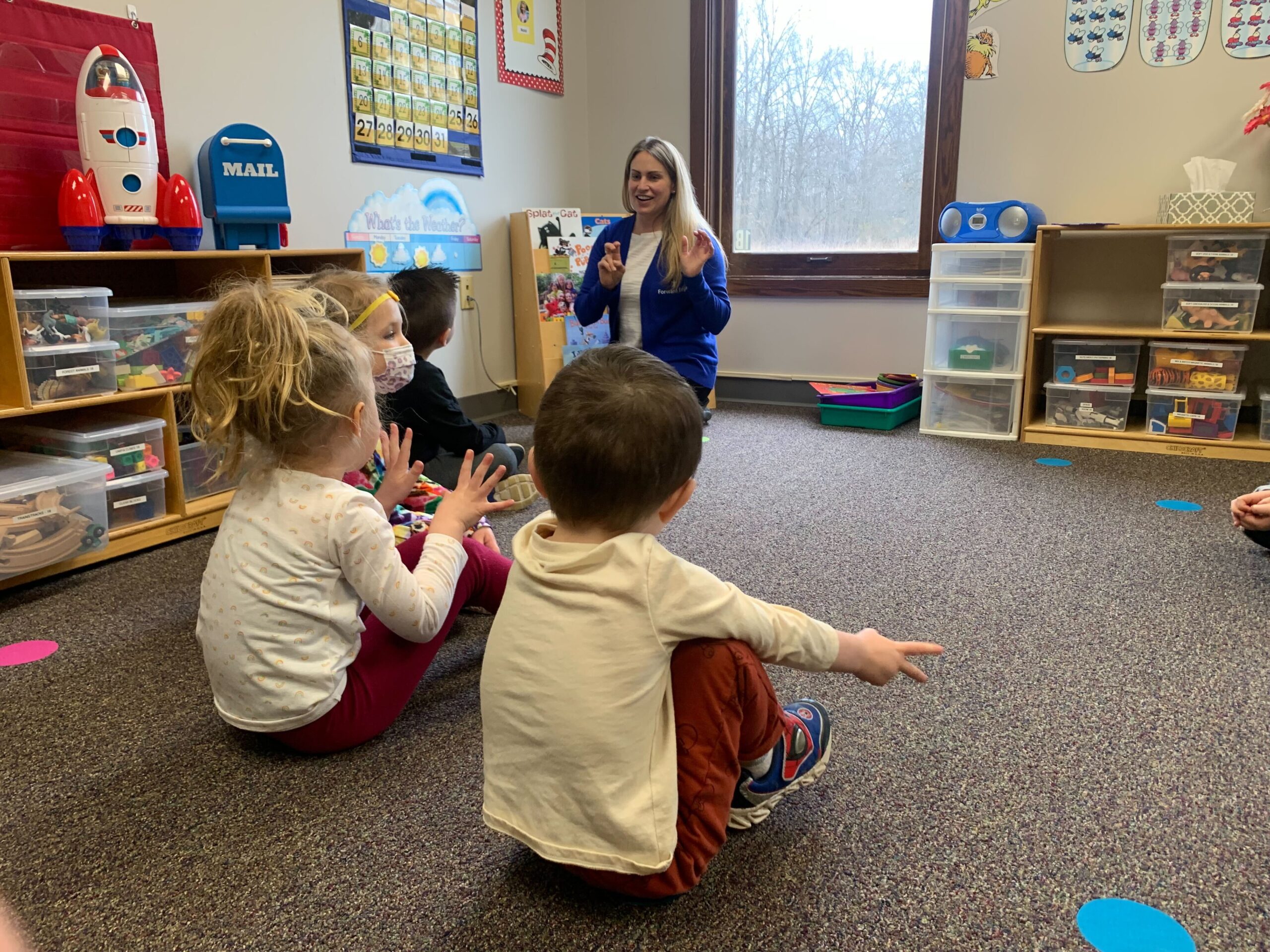 teacher instructing children